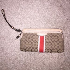 Brown coach wristlet/wallet with orange detailing!