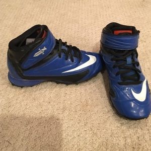 Size 2 Blue Nike Tim Tebow Football cleats.