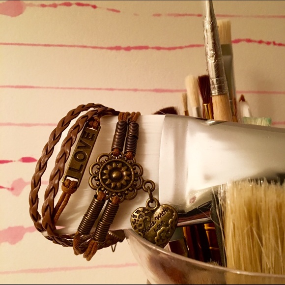 8 strand leather bracelet with 3 brass charms