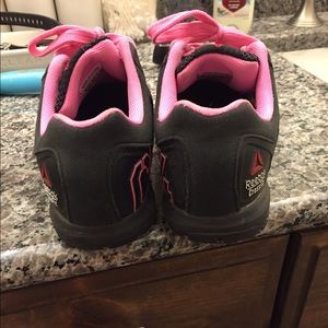 Reebok pink and black nanos.