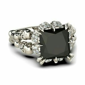 Skull Holding a Beautiful 4ct Black Cz Ring