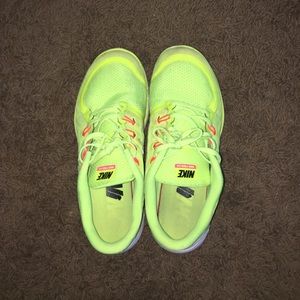 Neon yellow Nike free 5.0 running shoes
