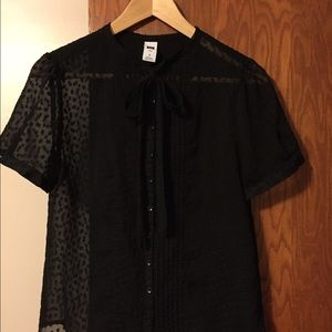 Sheer button-down blouse.