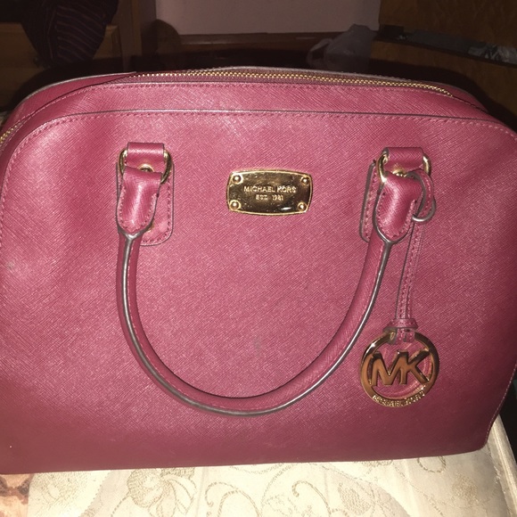 Maroon Michael Kors cross body.