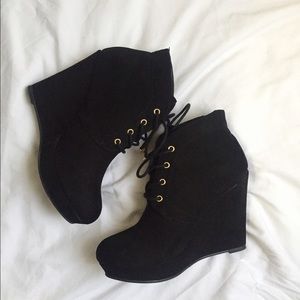 Black "suede" lace up booties.