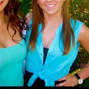 Bright teal sleeveless tie-up blouse