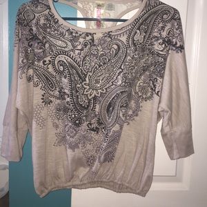 Beige top with design on front & lace back