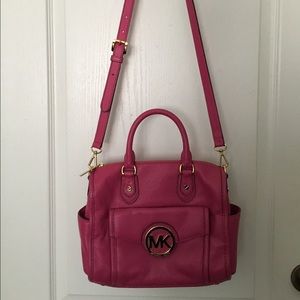 This is a pink Michael Kors shoulder/handbag