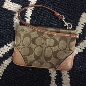 Coach wristlet in signature fabric