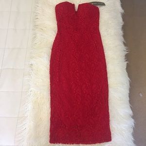 Red midi-length lacy dress with deep v front cut