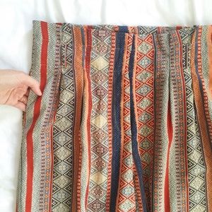 Paper bag waist tribal print trousers.