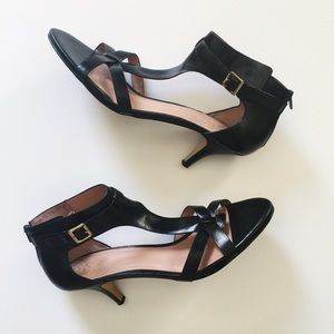 Black strappy low heeled sandals.