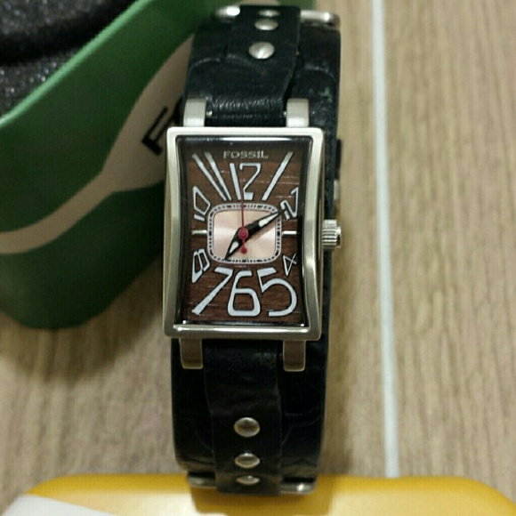 Fossil tin watch and cloth bag