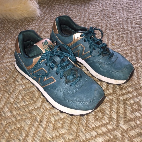 Green and gold new balance tennis shoes