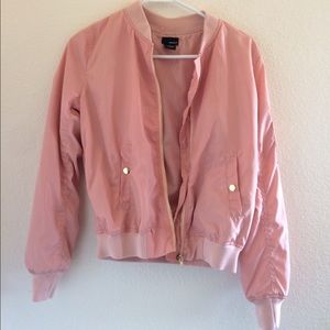 Pink bomber jacket.