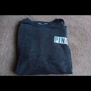 ON HOLD VS PINK pullover.