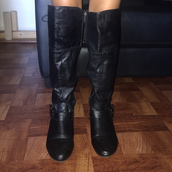 Black leather boots under the knee
