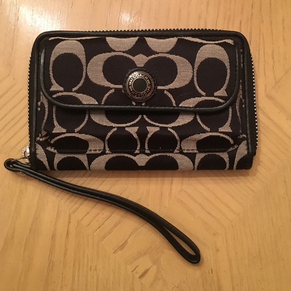 Brand new Coach wristlet in classic print