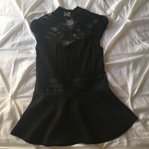 Lace accented peplum top