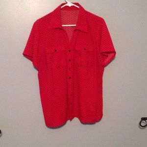 Red with black polka dot shirt