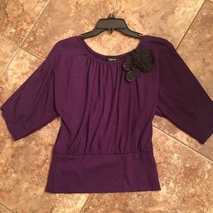 Dark purple top with flower decoration