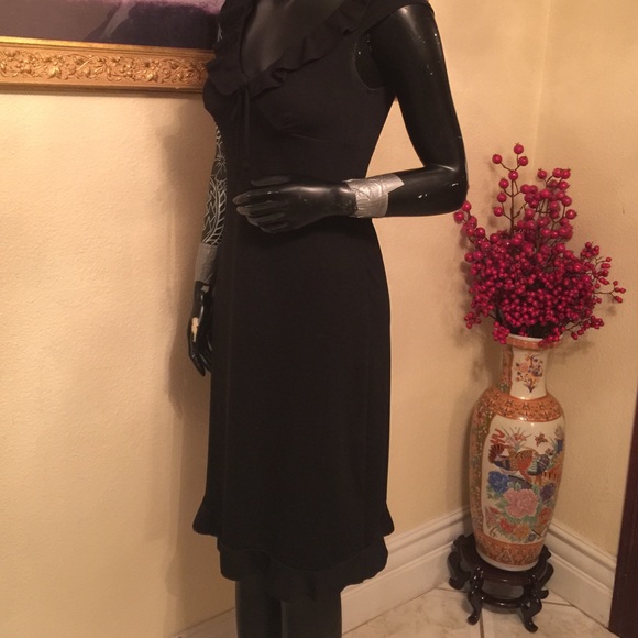 Black dress with ruffle detail.