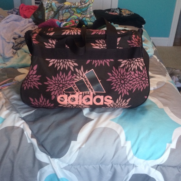 A beautiful brown flowery adidas duffle bag