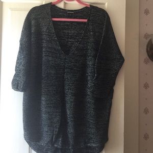 Grey v neck sweater.