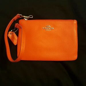 Orange coach wristlet