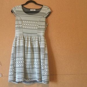 A black and white short dress with cap sleeves