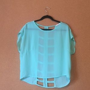 Sea foam green shirt with cuts down back