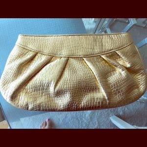 Gold snakeskin clutch