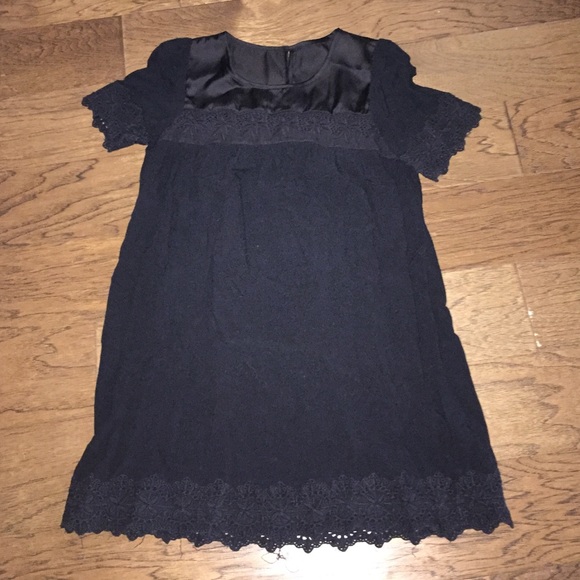Black small dress from Lucca with lace detail.