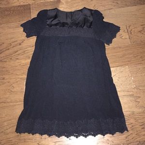 Black small dress from Lucca with lace detail.
