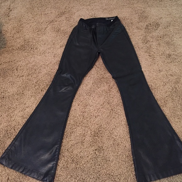 black faux leather flared trousers