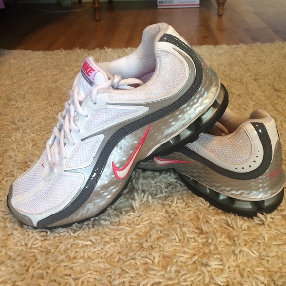 Nike size 8 white and silver running shoes.