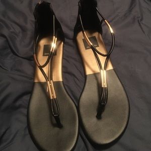 Never worn Dolce Vita gold and black sandals