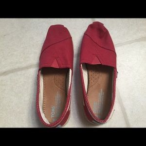 Toms slip on's.