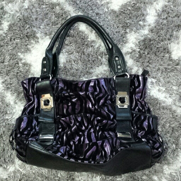 Purple and black zebra striped handbag