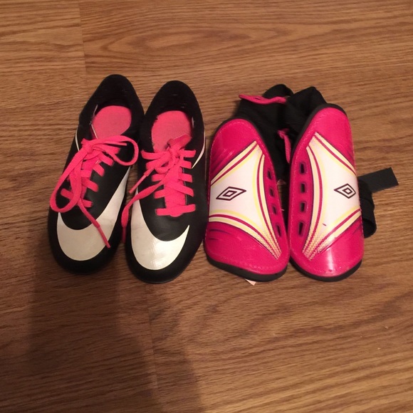 Nike soccer cleats and pink shin guards