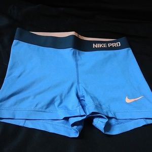 Blueberry and peach colored Nike Pro spandex