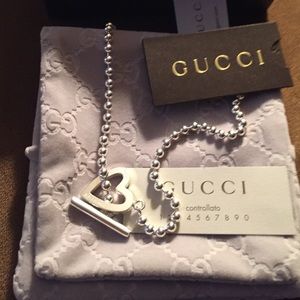 Authentic Gucci heart necklace with beaded chain..