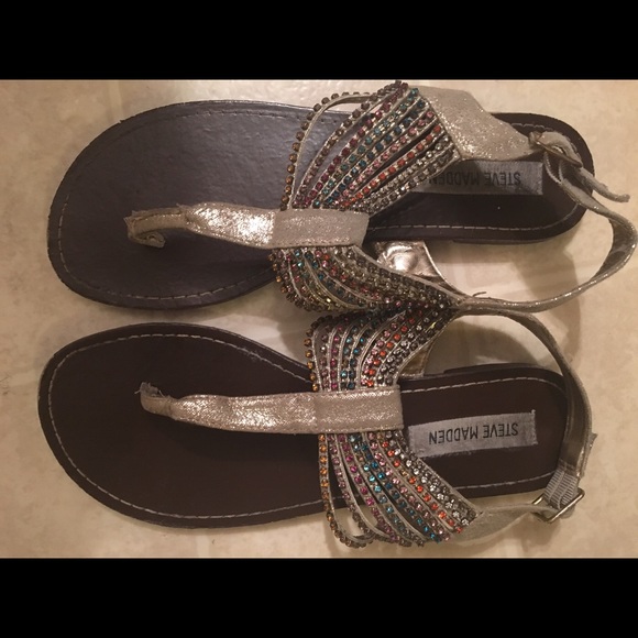STEVE MADDEN silver flat sandals.