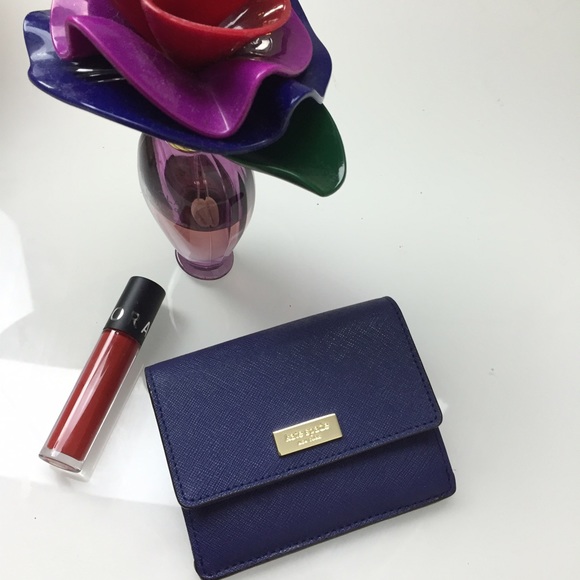 kate spade Handbags - NWT Kate Spade Newbury Lane Petty Wallet in Indigo