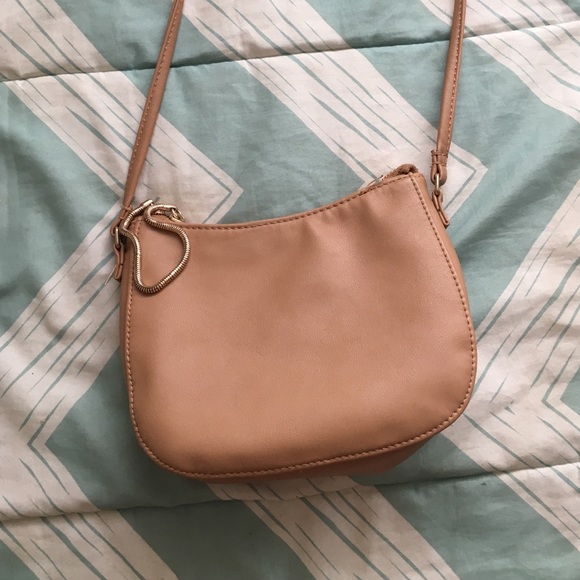 Tan leather across the shoulder bag