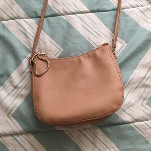 Tan leather across the shoulder bag