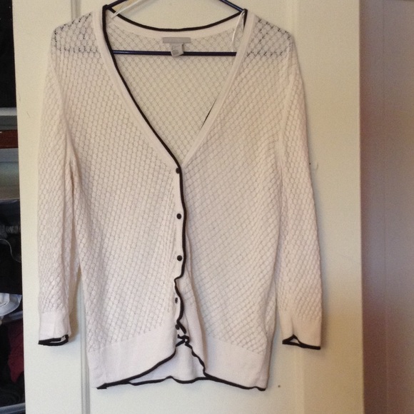 White knit button down sweater with black Trim