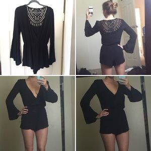 Black long sleeve romper w/ lace detail back