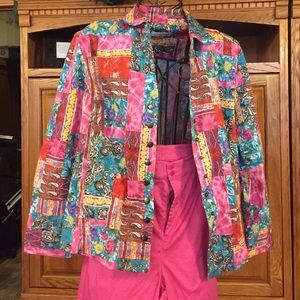 Pink, blue, and yellow jacket with pink pants.