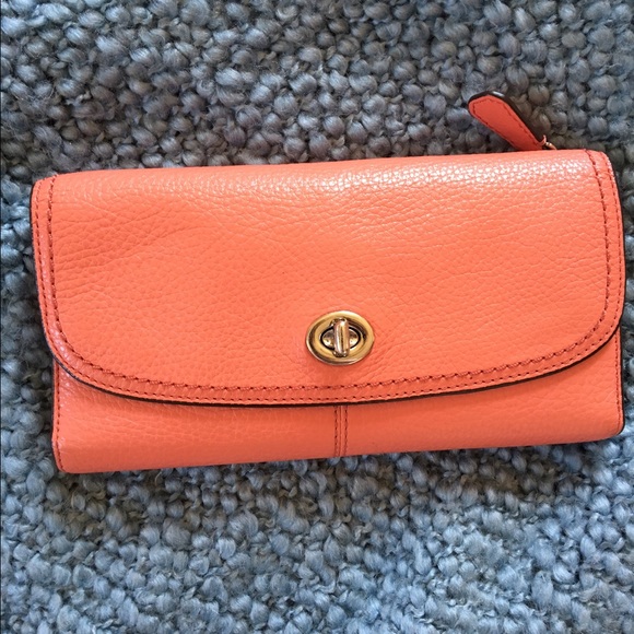 Pink/Coral Coach wallet.